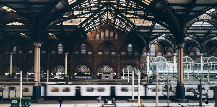 Interior of London Liverpool Street Station with platforms and trains