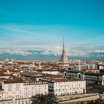 Panoramic view of Turin skyline with Mole Antonelliana and Alps in the background