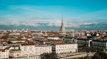 Panoramic view of Turin skyline with Mole Antonelliana and Alps in the background