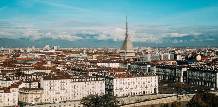 Panoramic view of Turin skyline with Mole Antonelliana and Alps in the background