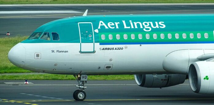 Aer Lingus Airbus A320 taxiing on runway at the airport