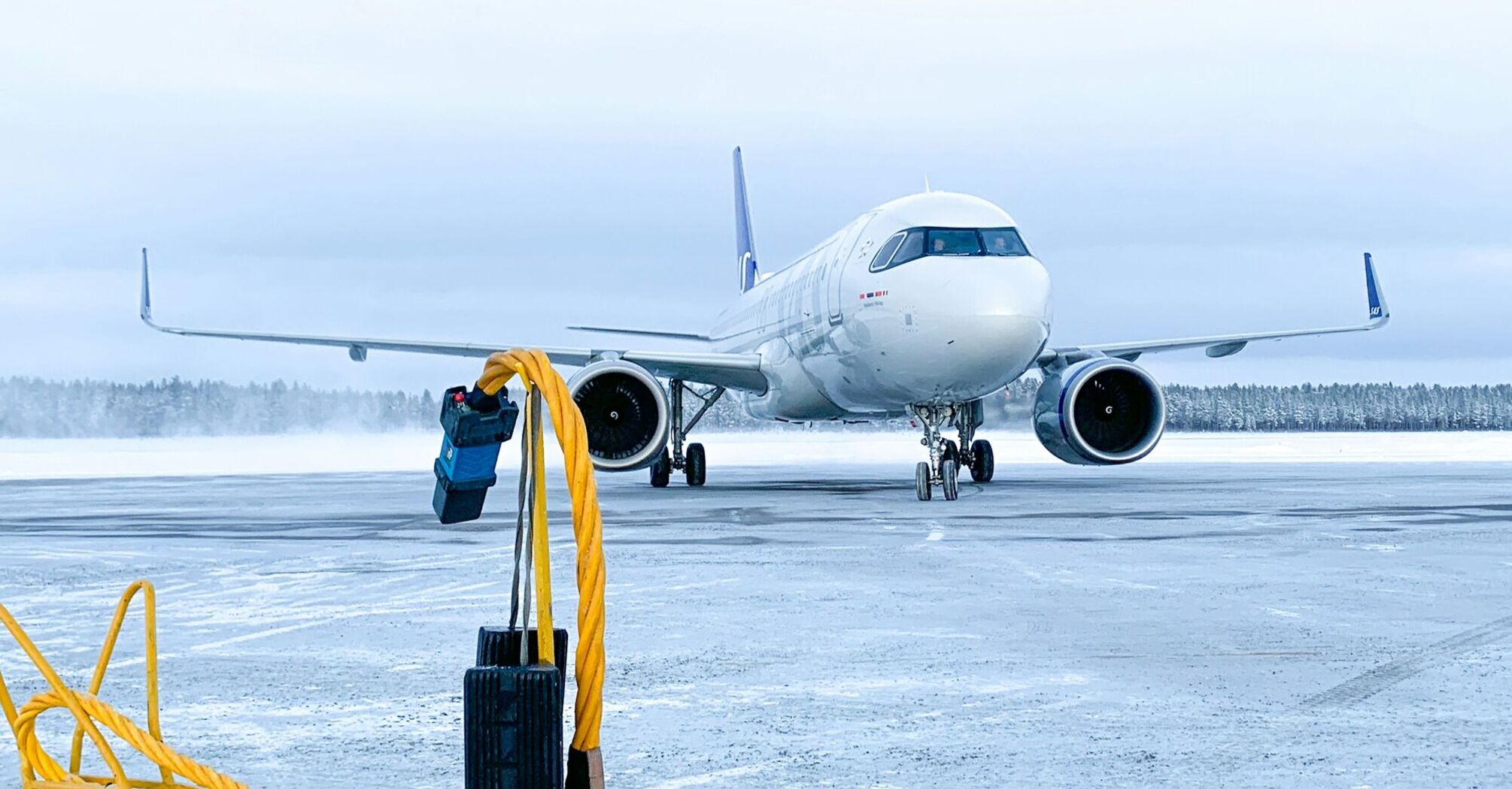 Commercial aircraft on icy runway during winter operations