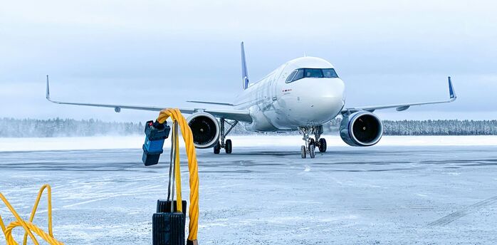 Commercial aircraft on icy runway during winter operations