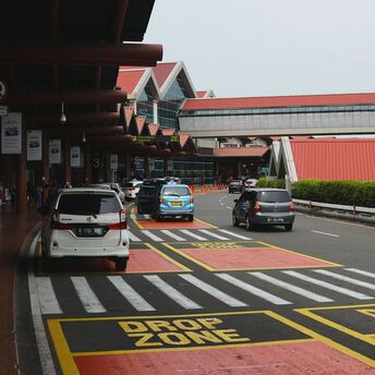 Airport drop-off zone with express lane and cars
