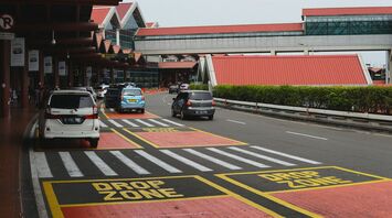Airport drop-off zone with express lane and cars