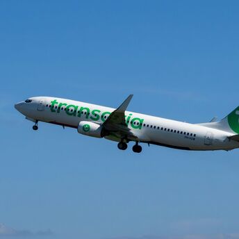 Transavia Boeing 737 aircraft in flight against blue sky