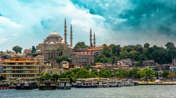 Istanbul skyline with mosque domes and boats along the waterfront