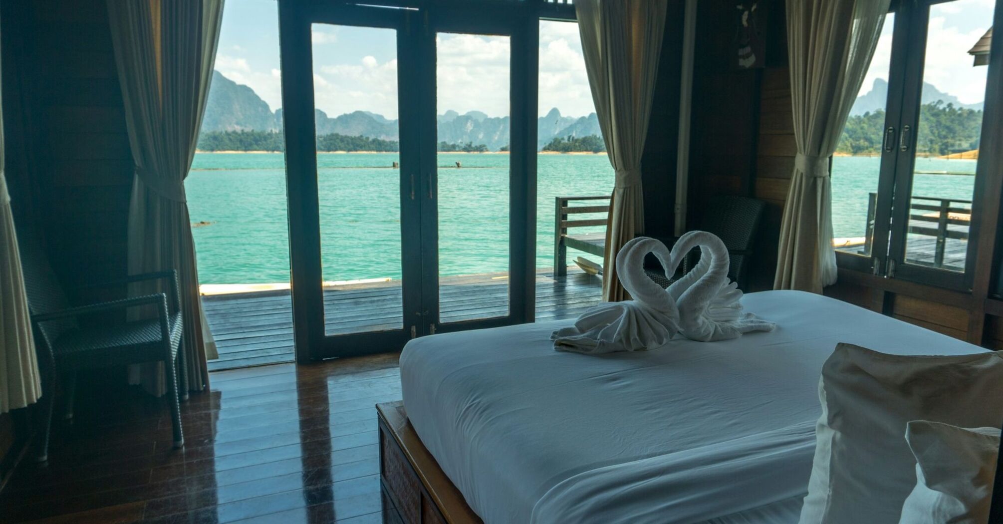 Hotel room with sea view and balcony doors in Thailand