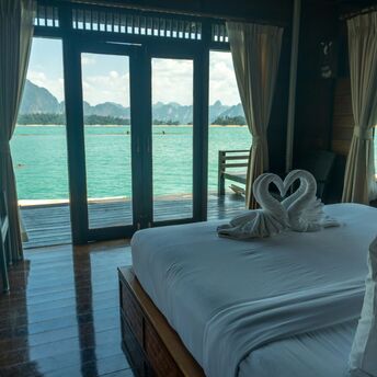Hotel room with sea view and balcony doors in Thailand