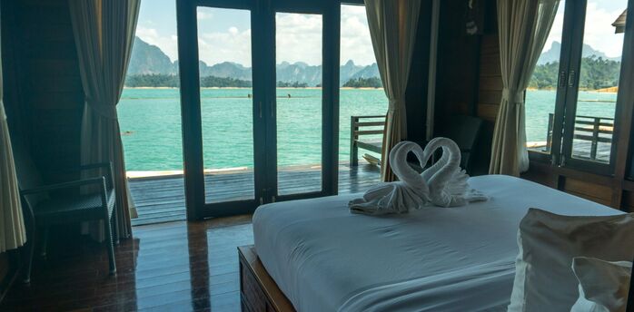Hotel room with sea view and balcony doors in Thailand