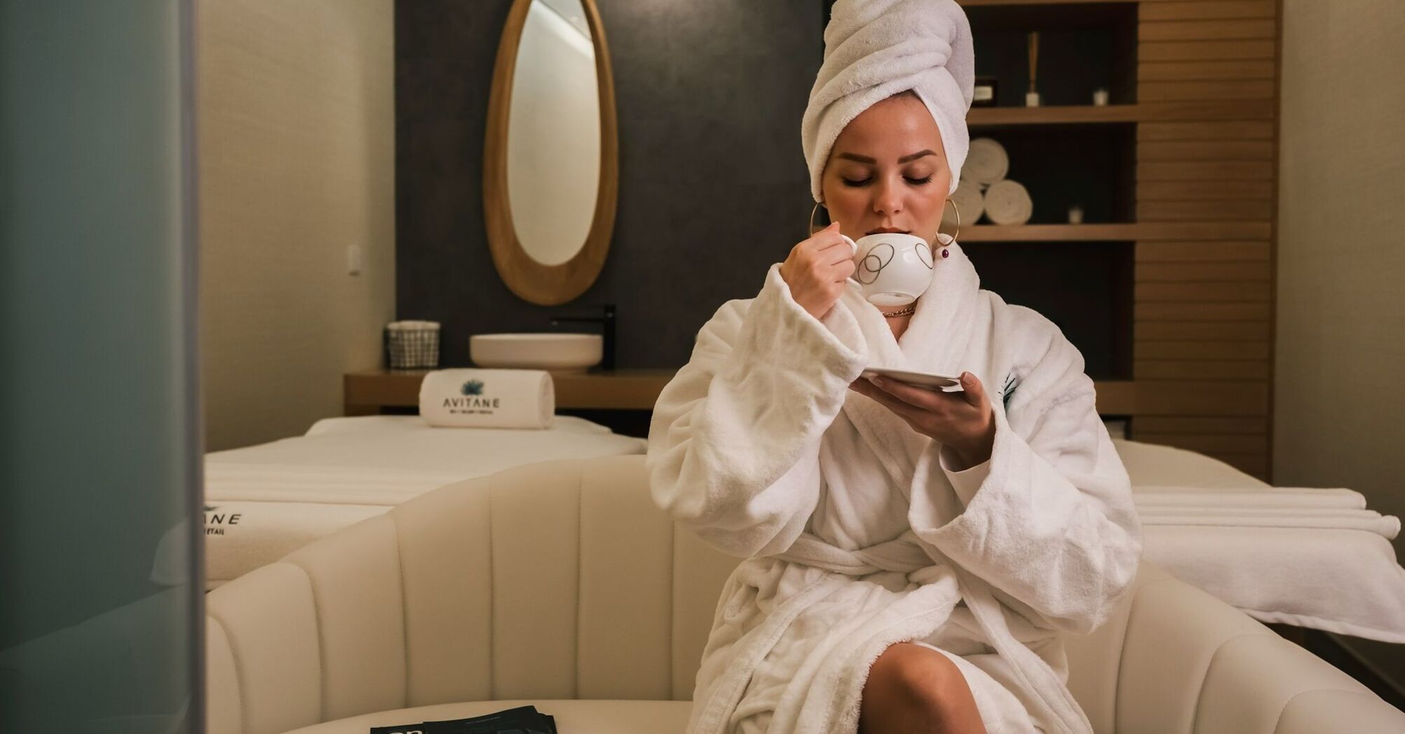 Guest relaxing in hotel spa lounge area 
