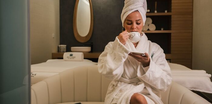 Guest relaxing in hotel spa lounge area