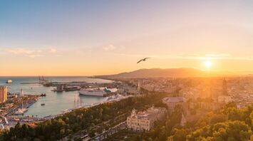 Aerial view of Málaga coastline and harbour at sunset