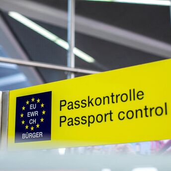 EU passport control sign inside airport terminal