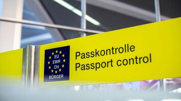 EU passport control sign inside airport terminal