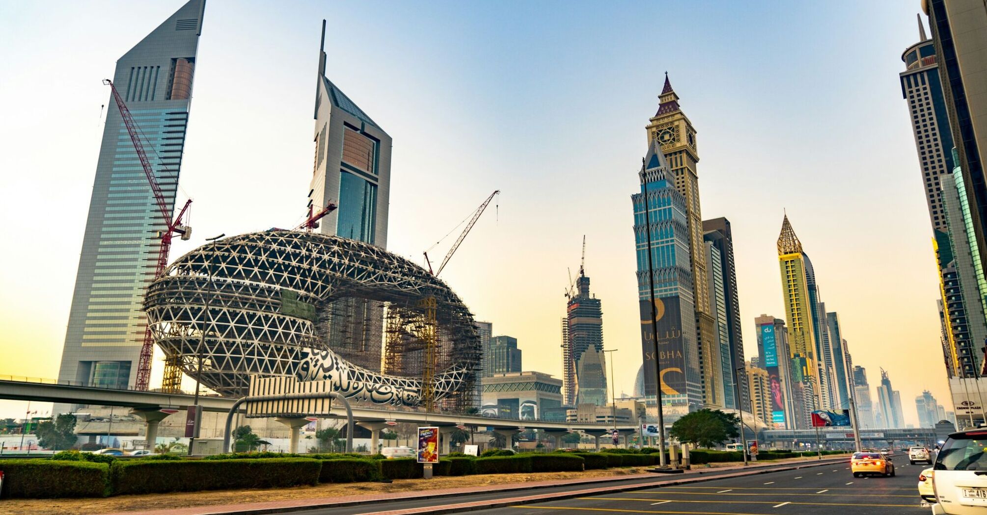 Dubai skyline with Museum of the Future and Sheikh Zayed Road traffic