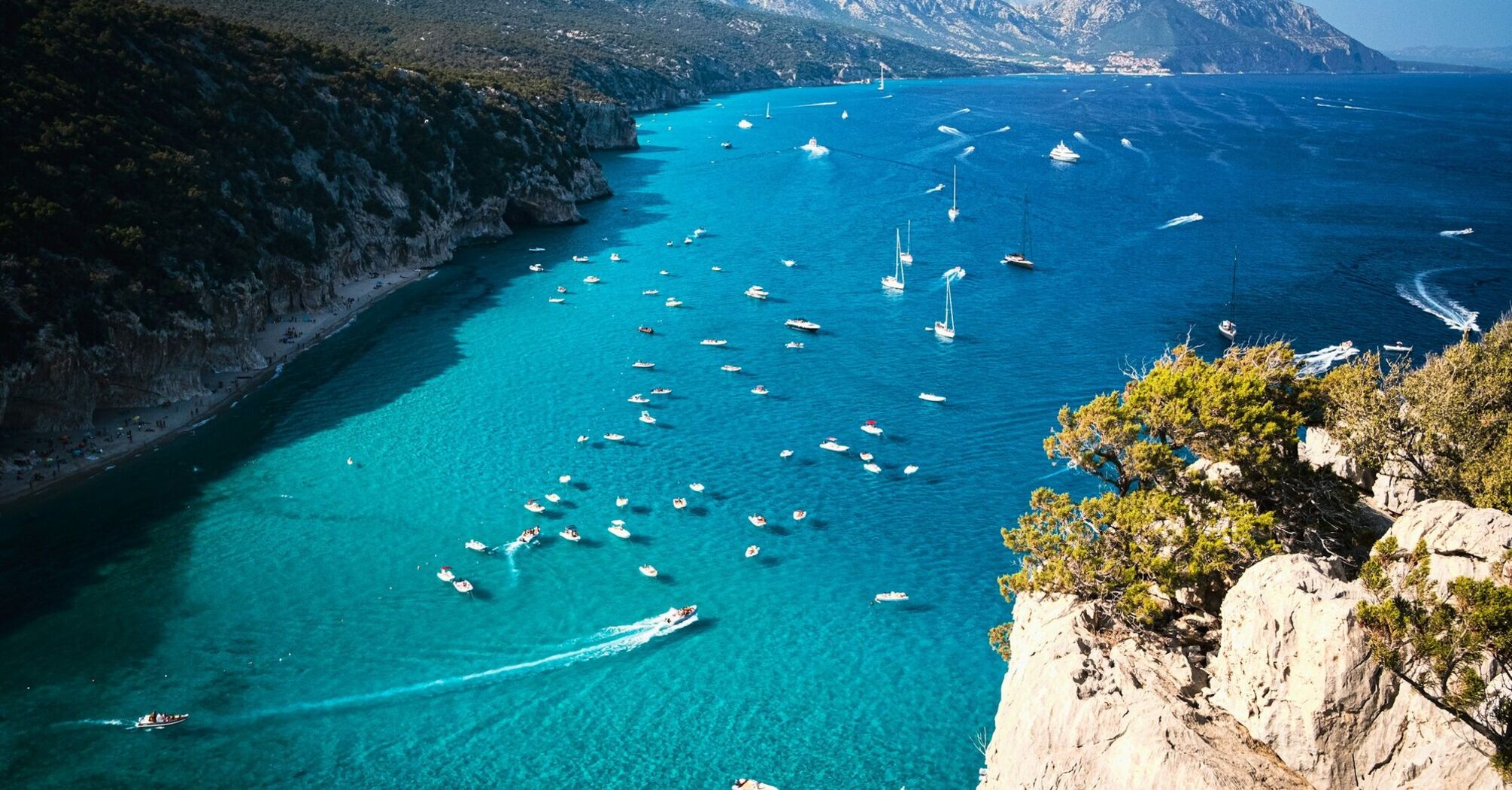 Boats gathered along Sardinia coastline during summe