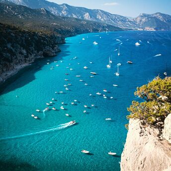 Boats gathered along Sardinia coastline during summe