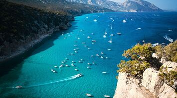 Boats gathered along Sardinia coastline during summe