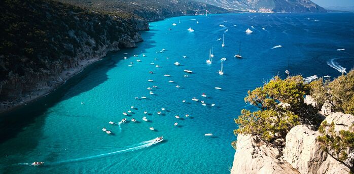 Boats gathered along Sardinia coastline during summe