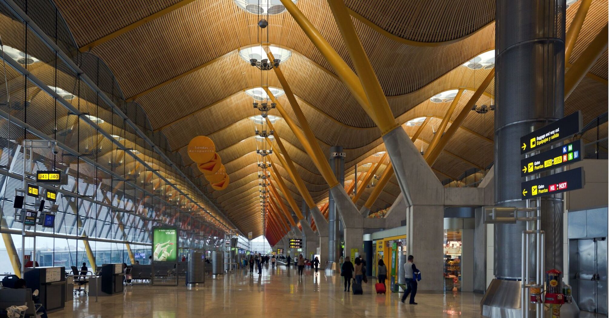Madrid-Barajas Airport terminal interior with departure gates and passenger walkway