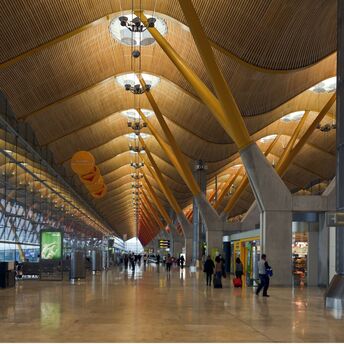 Madrid-Barajas Airport terminal interior with departure gates and passenger walkway