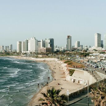 Tel Aviv coastline with city skyline and beach promenade