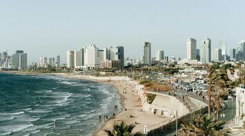 Tel Aviv coastline with city skyline and beach promenade