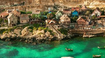 Colourful seaside village and clear waters in Malta