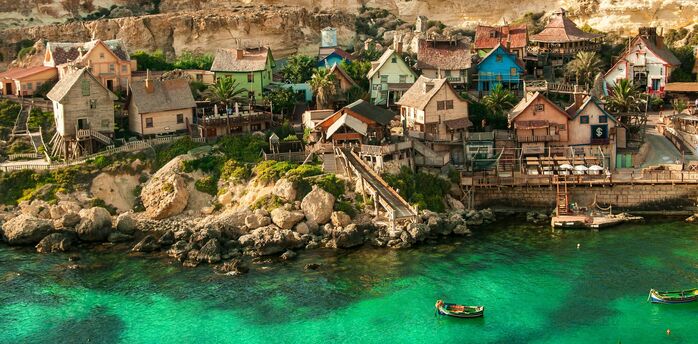 Colourful seaside village and clear waters in Malta