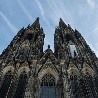 Cologne Cathedral Gothic façade with twin spires viewed from below