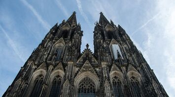 Cologne Cathedral Gothic façade with twin spires viewed from below
