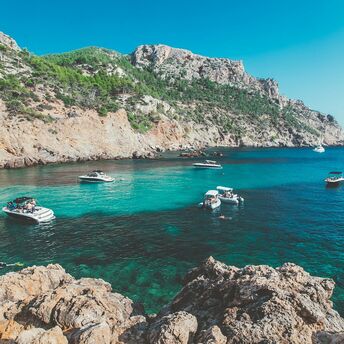 Mallorca coastline with boats in turquoise bay
