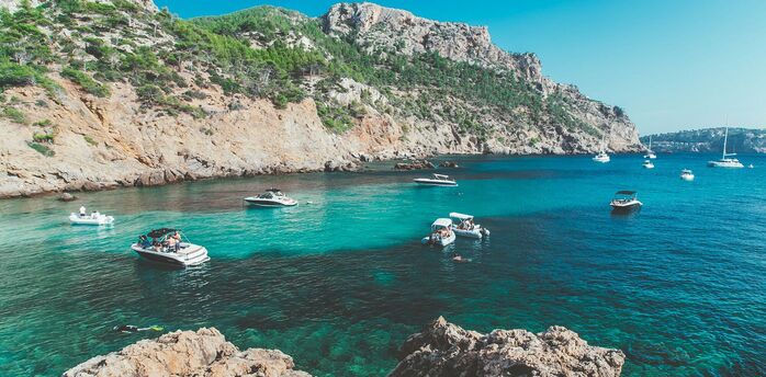 Mallorca coastline with boats in turquoise bay