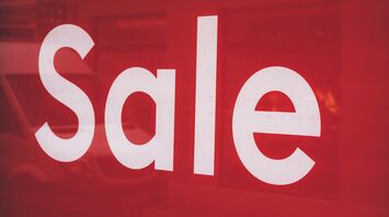Red sale sign displayed on the window