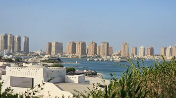 Doha skyline with Pearl Qatar towers along the waterfront