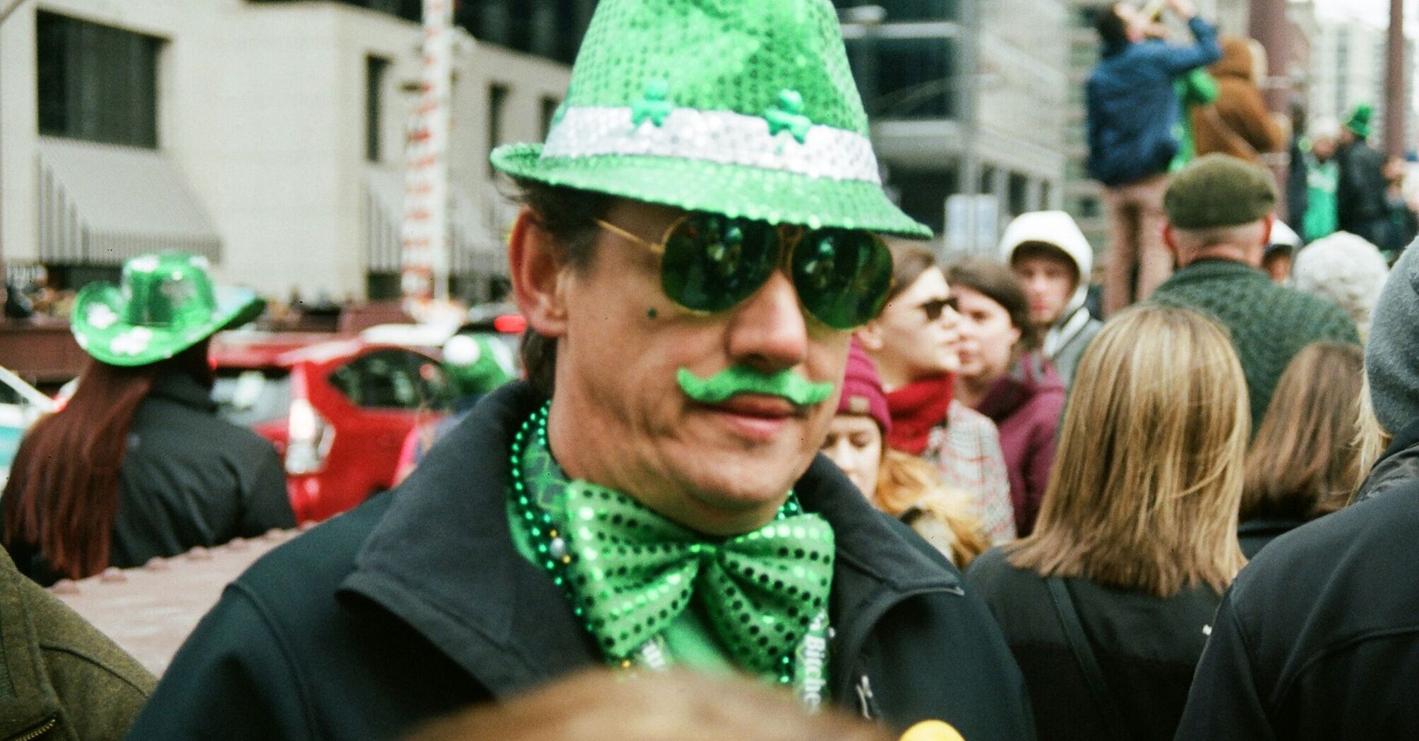Person dressed in green during St Patrick’s Day street celebration