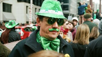 Person dressed in green during St Patrick’s Day street celebration