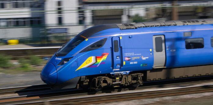 Lumo high-speed train travelling on UK railway tracks