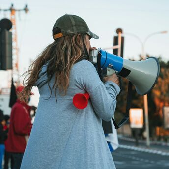 Protester speaking through megaphone during strike