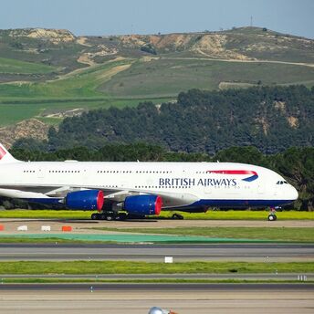 British Airways aircraft taxiing on runway during daytime operations