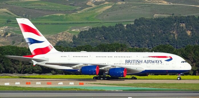 British Airways aircraft taxiing on runway during daytime operations