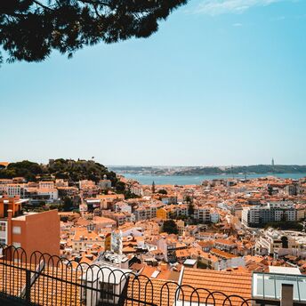 Lisbon city skyline with river and historic rooftops