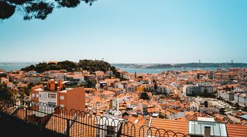 Lisbon city skyline with river and historic rooftops
