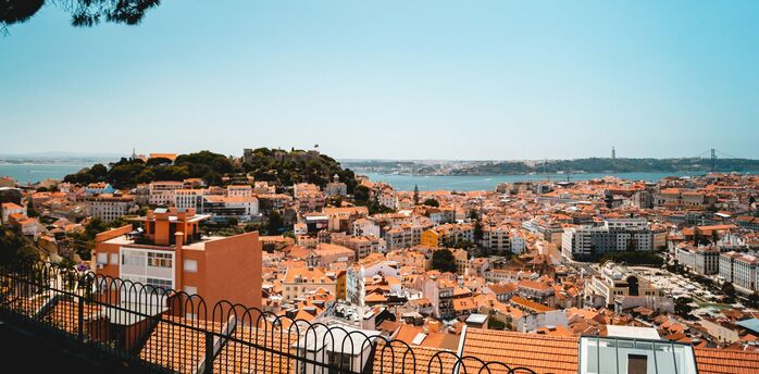 Lisbon city skyline with river and historic rooftops