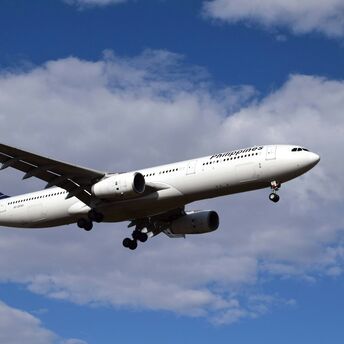 Philippine Airlines aircraft approaching runway for landing