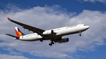 Philippine Airlines aircraft approaching runway for landing