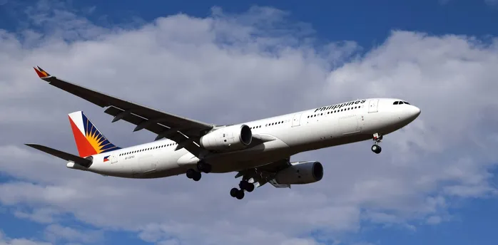 Philippine Airlines aircraft approaching runway for landing