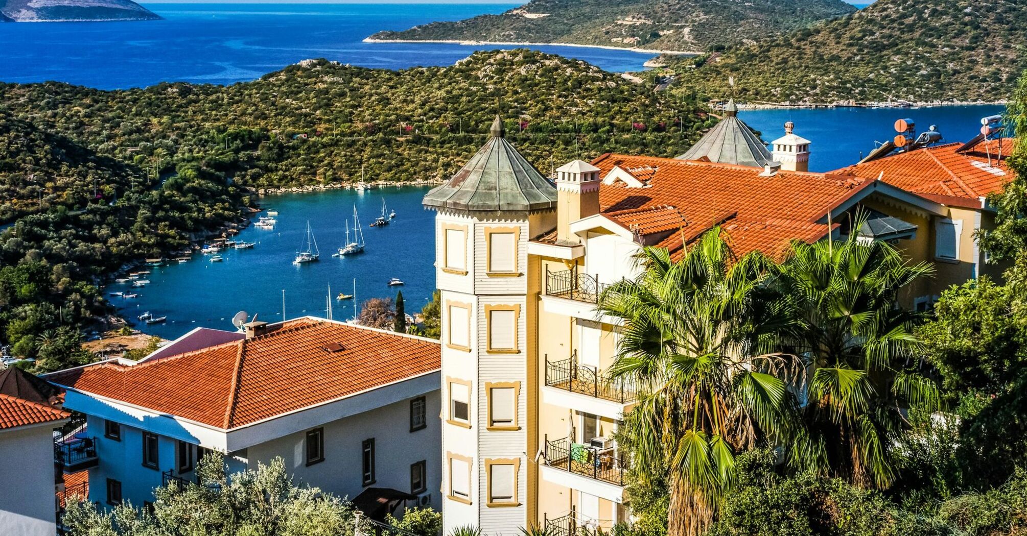 Coastal view of Antalya with boats and hillside houses