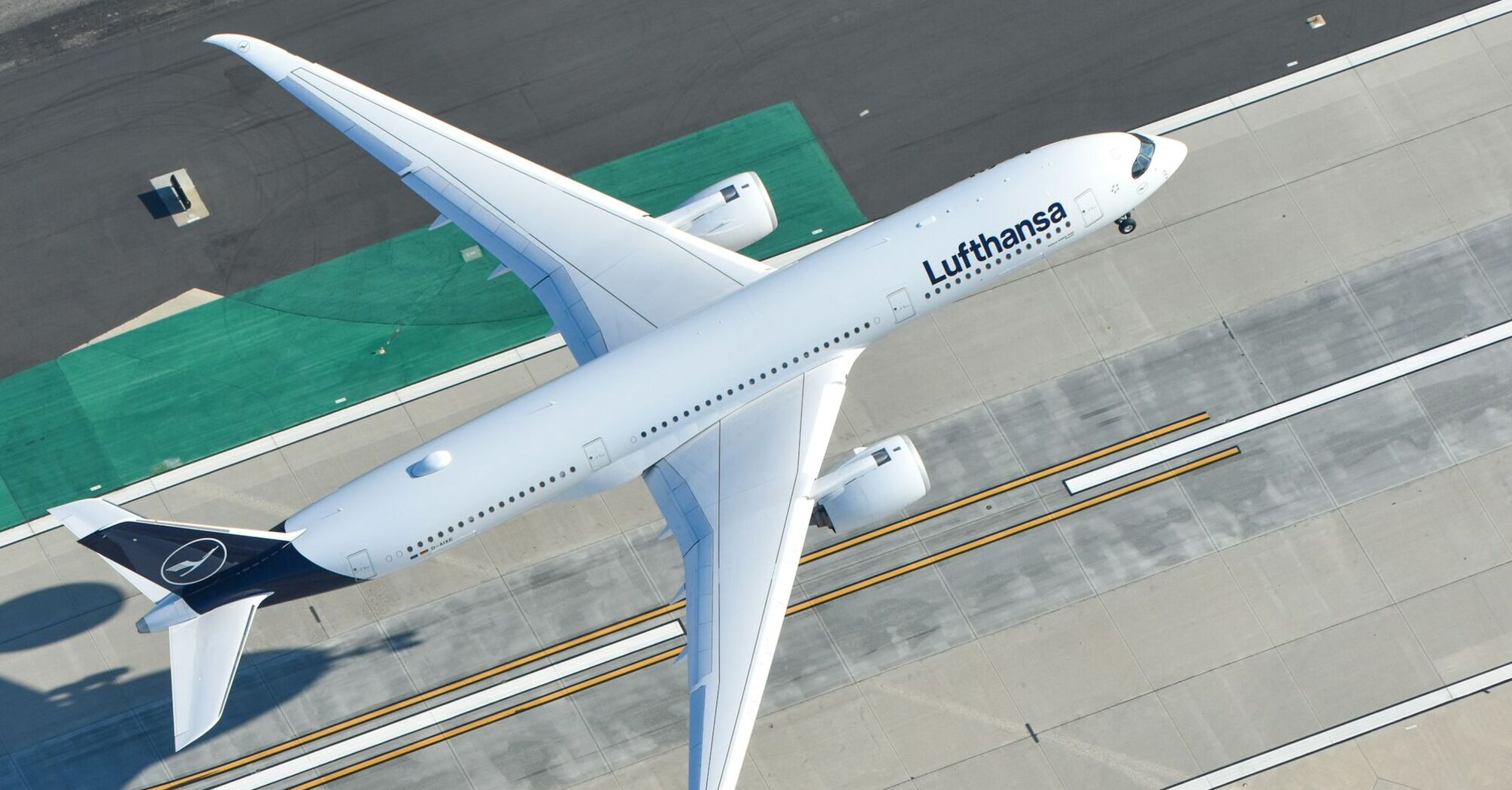 Lufthansa aircraft taxiing on airport runway